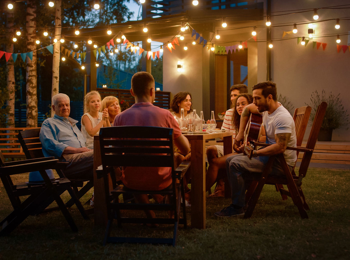 Families gathered around a table outdoors